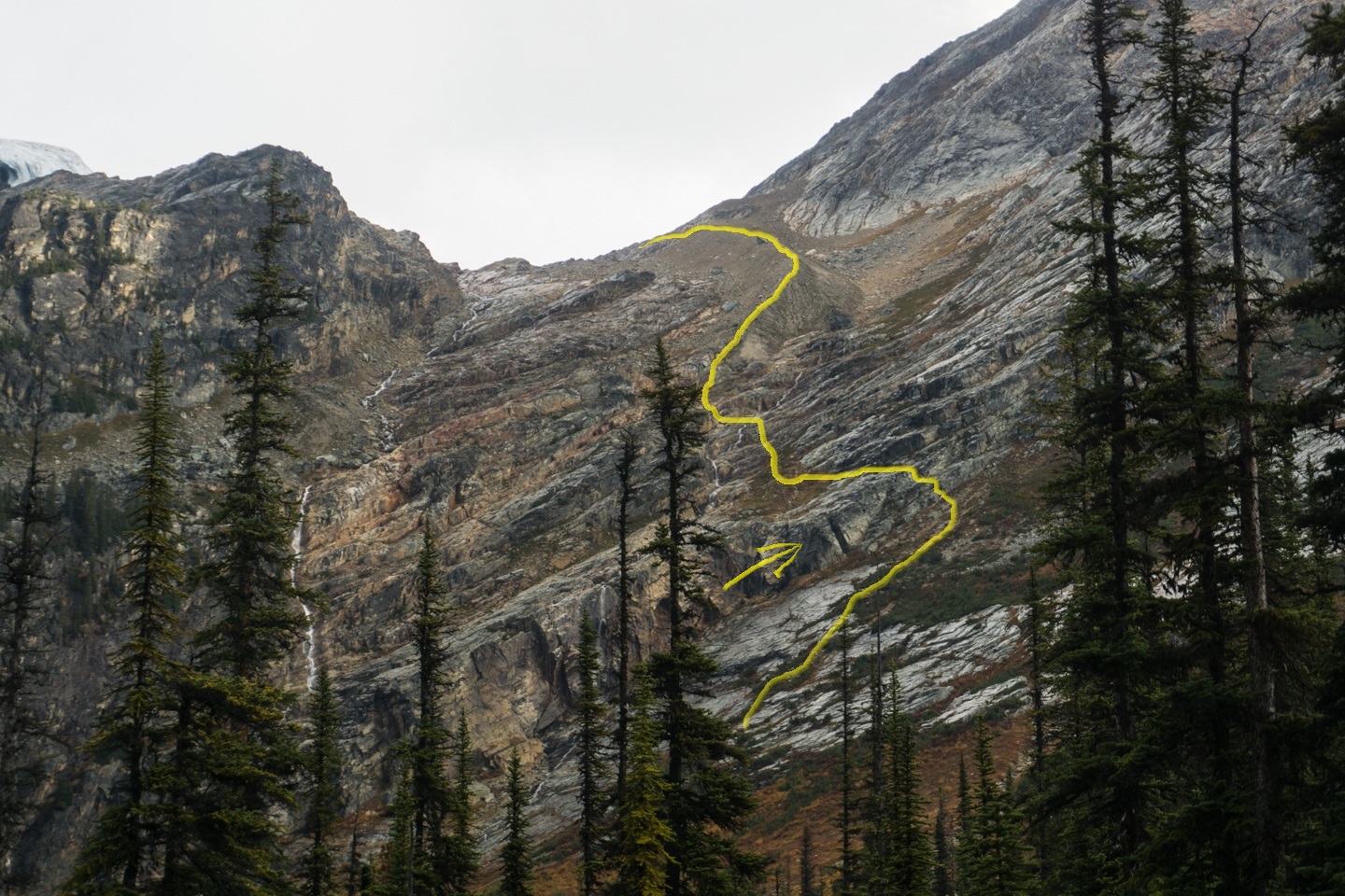 Yellow: Route up the rock ledge and moraine. Arrow points to triangular landmark